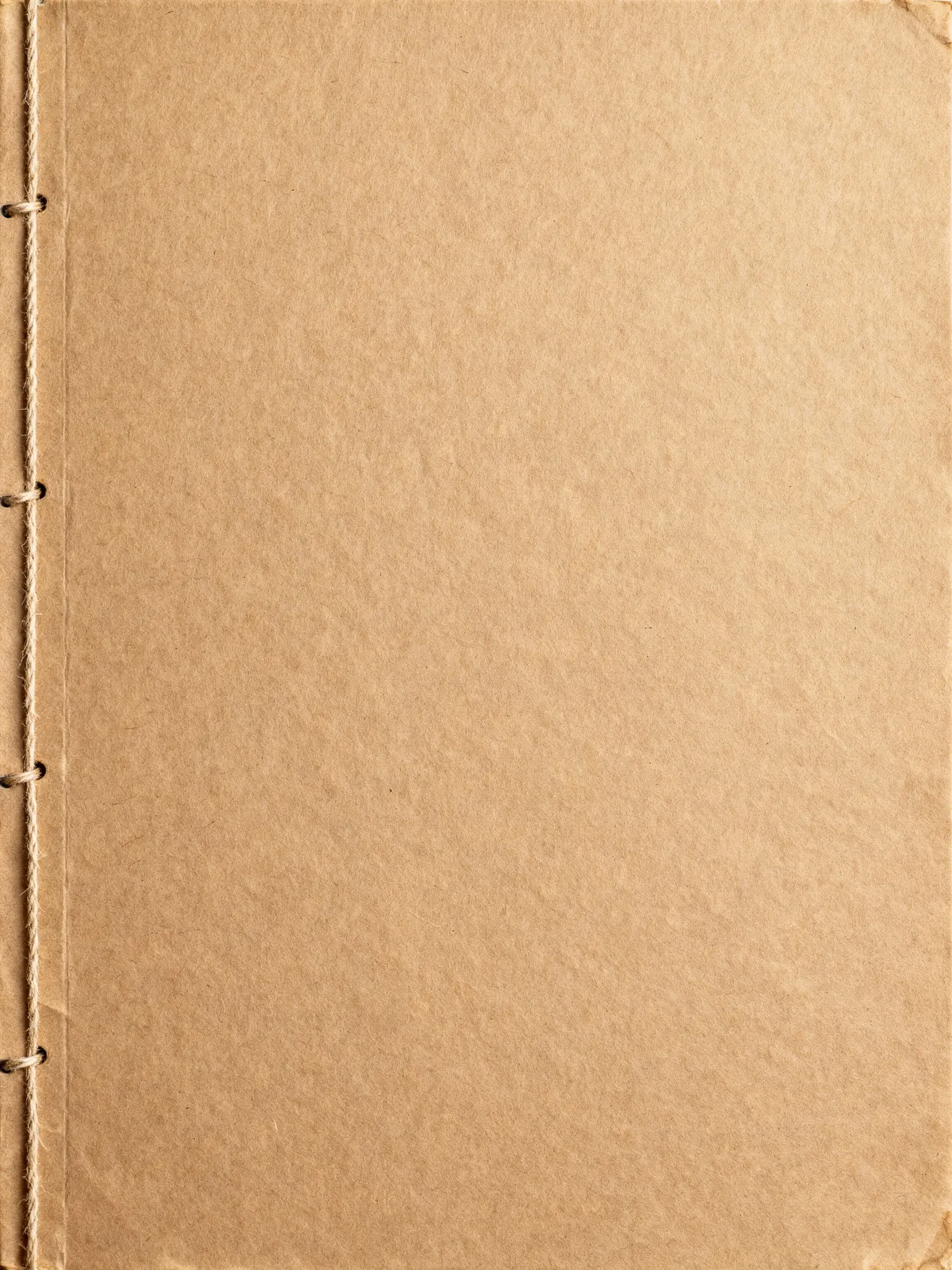 old photo album paper with a string binding on the side