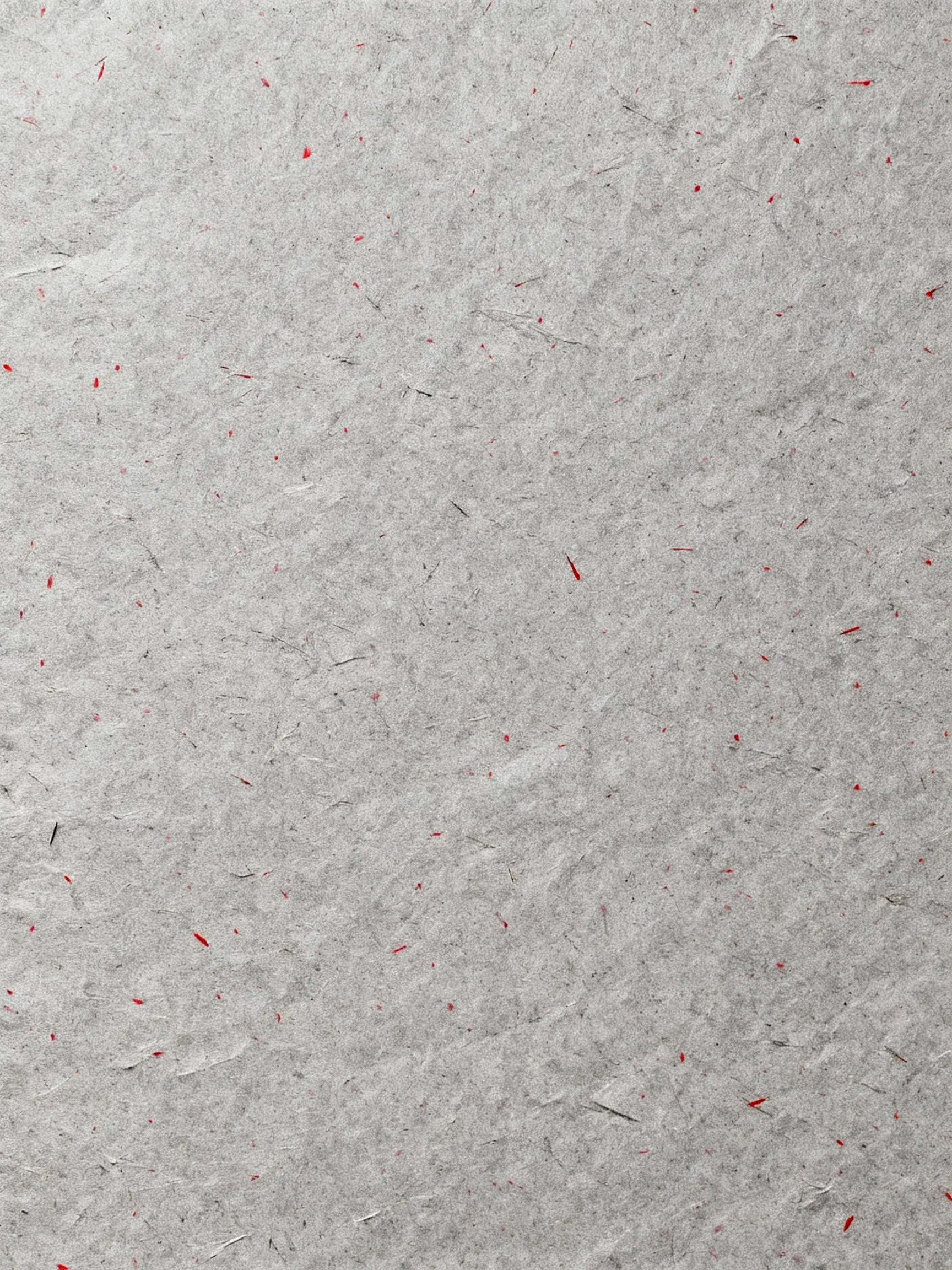 Gray paper texture with red speckles